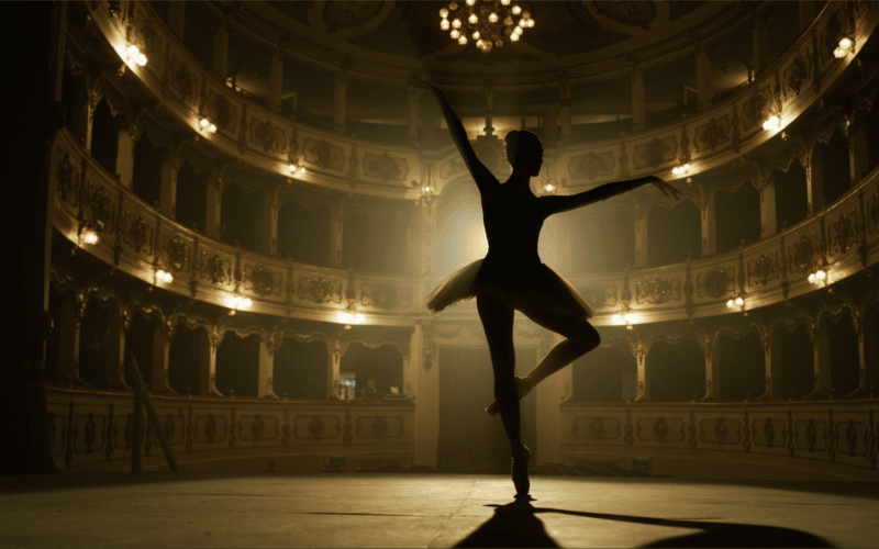 Backlit ballerina on stage