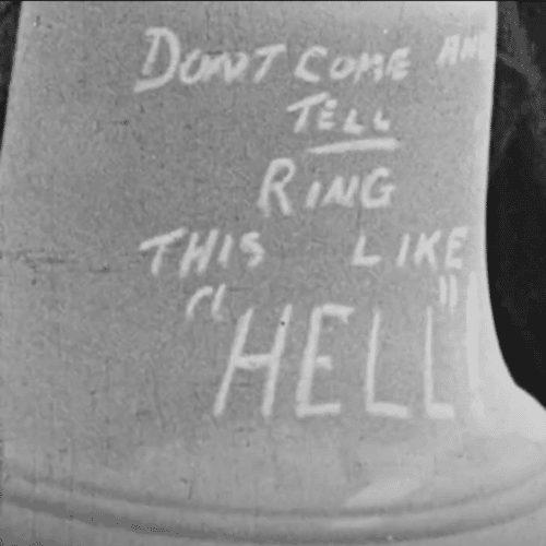 Black and White Photograph of a bell that says Don't Come and Tell Ring This Like "Hell"