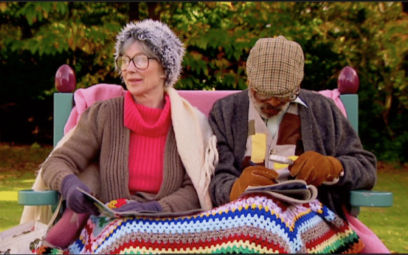 Shirley Anne Field and Kenny Lynch on park Bench