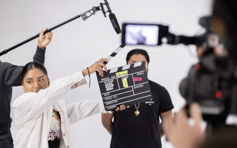 Studio crew filming piece to camera